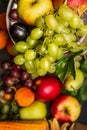 Grapes on summer fruits and vegetables background top view, close up Royalty Free Stock Photo