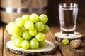 Grapes used in distilled drinks such as Portuguese cachaÃÂ§a, brandy, graspa or Italian grappa. Spot focus, glass in the background Royalty Free Stock Photo