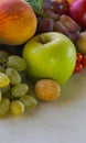 Grapes and various autumn fruits on the table Royalty Free Stock Photo
