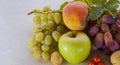 Grapes and various autumn fruits on the table Royalty Free Stock Photo