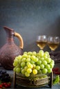 Grapes and wine in a jug and glasses Royalty Free Stock Photo