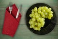 Grapes on a wooden background. grapes on a plate Royalty Free Stock Photo