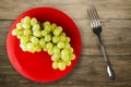 Grapes on a wooden background. grapes on a plate Royalty Free Stock Photo