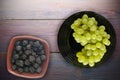 Grapes on a wooden background. grapes on a plate Royalty Free Stock Photo