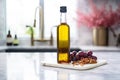 grapeseed oil in dark glass bottle on marble table