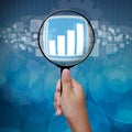 Graph button in Magnifying glass Royalty Free Stock Photo