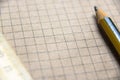 Graph paper of notebook background, blank page of retro sketchbook with old pencil and ruler Royalty Free Stock Photo