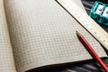 Graph paper of notebook background, blank page of retro sketchbook and pencil Royalty Free Stock Photo