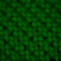 black background with blurred green spots