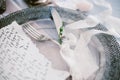 Graphic arts of beautiful wedding calligraphy cards and silver plate with cutlery. Royalty Free Stock Photo