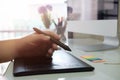 graphic design desk hand using mouse pan sketch device. Royalty Free Stock Photo