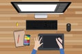 Graphic design workspace with digital sketching and monitor
