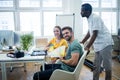 Graphic designer discussing over color swatch with a colleague Royalty Free Stock Photo