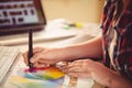Graphic designer drawing on colour chart Royalty Free Stock Photo