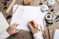 Graphic designer drawing geometry shapes at table, top view