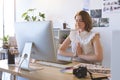 Graphic designer with hand clasped doing yoga in creative office Royalty Free Stock Photo