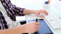 Graphic designer using digitizer at his desk