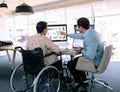 Graphic designers discussing over computer at desk in a modern office Royalty Free Stock Photo