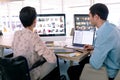 Graphic designers working together at desk in a modern office Royalty Free Stock Photo