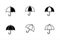 Set of Umbrella Icons: Solid and Outline Styles Royalty Free Stock Photo