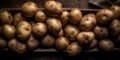 Potatoes on a dark background, giving them an elegant and minimalist appearance.