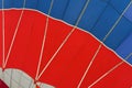 Graphic and geometric texture of hot air balloon, Bottom view, as background for bright moments of life, vivid red and Royalty Free Stock Photo