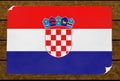 Illustration of a Croatian flag painted on the papier pasted on the woody wall