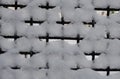 The graphic resource consists of a metal grid covered with snow.
