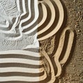 Graphic Striped Hat and Shadow on Textured Sand Royalty Free Stock Photo