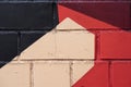 Graphic stylish fragment of dirty and stained wall with old chipped paint in red and black shades, scratch, grunge Royalty Free Stock Photo
