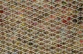 The graphical resource consists of a metal grating on felt.