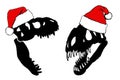 Graphical set of silhouettes of dinosaur skulls in Santa Claus red hat ,vector Christmas elements Royalty Free Stock Photo