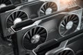 Graphics cards GPU standing in a row in mining farm or 3d render farm. IT hardware Royalty Free Stock Photo