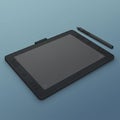 Graphics tablet with a stylus pen on a blue surface. The tablet is rectangular with a Royalty Free Stock Photo