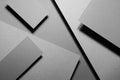 Graphite grey abstract geometric background with soar rectangle spaces, stripes, lines, corners in hard light, black shadows.