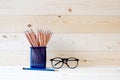 Graphite pencils in basket and eyeglasses Royalty Free Stock Photo