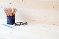 Graphite pencils in basket and eyeglasses Royalty Free Stock Photo