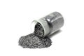 Graphite powder spilling from a glass container Royalty Free Stock Photo