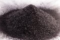 Graphite powder used in industry, black powder with isolated white background and copy space Royalty Free Stock Photo