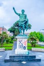 graphitti covered statue of julius caesar in italian city naples....IMAGE