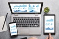 Graphs and charts elements on laptop, tablet and smartphone screen Royalty Free Stock Photo
