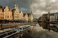 Graslei quay in the historic city center of Ghent, with boats bridge and old flemish buildings, Belgium Royalty Free Stock Photo