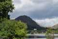 Grasmere, Cumbria, Lake and village, overlooked by Helm Crag