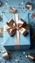 Grasping paper gift box, blue bow, sequins on pastel. Top-view elegance captured.