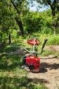 Grass cutter / brush cutter for trimming overgrown grass