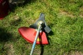 Grass cutter / brush cutter for trimming overgrown grass