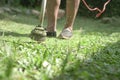 Grass cutting. Man using electric grass trimmer to mow lawn Royalty Free Stock Photo