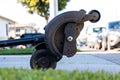 Grass edger resting in the driveway before being used to edge the lawn on a sunny winter afternoon Royalty Free Stock Photo