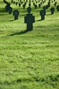 Grass field with crosses during sunset, cemetery Royalty Free Stock Photo