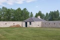 Grass field next to the corner building of Lower Fort Garry in Canada